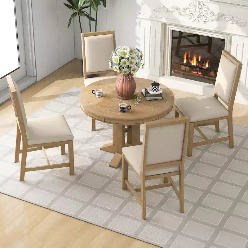 Ensemble de salle à manger de ferme Whisen 5 pièces, comprenant une table à manger ronde extensible et 4 chaises rembourrées.