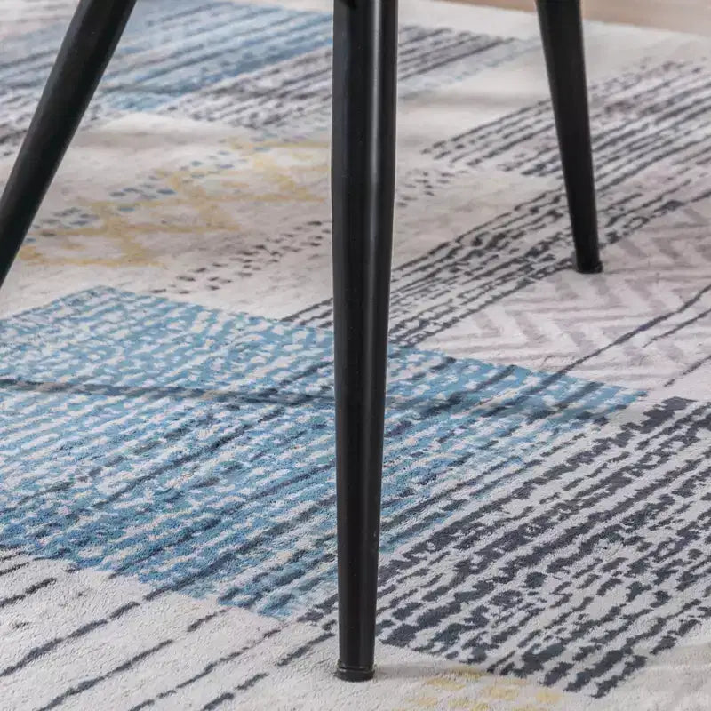 Fauteuil d'appoint en cuir marron foncé avec dossier capitonné et accoudoirs ailés