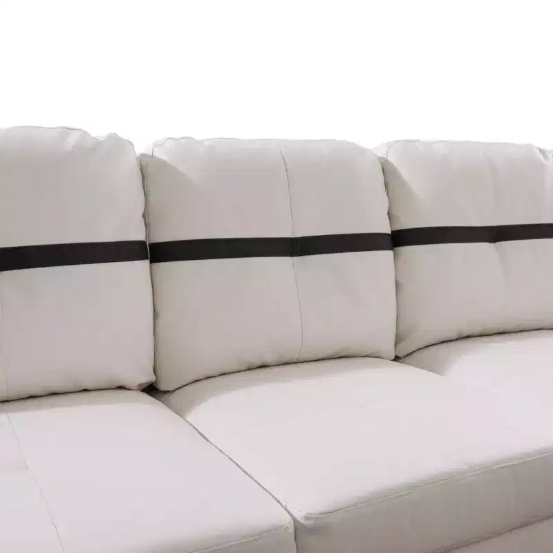 Canapé d'angle en similicuir blanc et noir – Design moderne en L, coussins capitonnés, pouf de rangement, décoration intérieure élégante