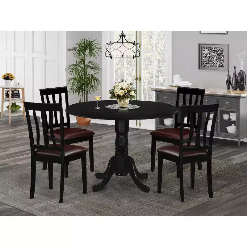 Table à manger ronde 5 pièces HomeStock avec plateau en bois massif finition noire et 4 chaises