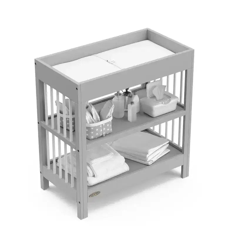 Table à langer Teddi de Graco avec matelas à langer résistant à l'eau