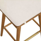 Tabouret de bar hauteur comptoir Nathan James Barker : Siège rembourré en forme de selle, pieds en hévéa massif, 61 cm de haut