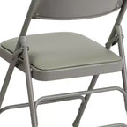 Lot de 4 chaises pliantes en métal rembourrées incurvées HERCULES à triple entretoise et double charnière de Flash Furniture
