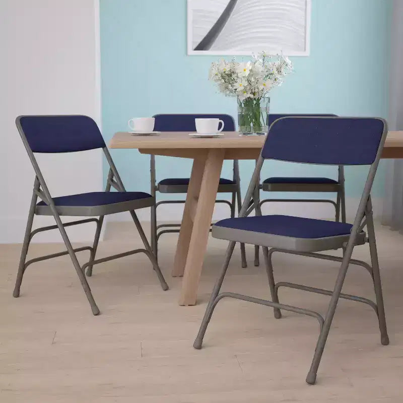 Lot de 4 chaises pliantes en métal rembourrées incurvées HERCULES à triple entretoise et double charnière de Flash Furniture