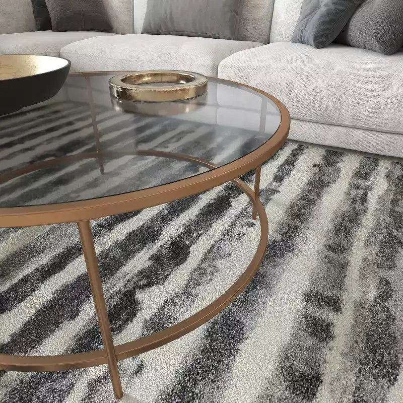 Table basse en verre Newbury Merrick Lane avec cadre rond doré mat et pieds verticaux