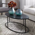 Table basse ovale industrielle moderne Uttermost en fer noir vieilli et aluminium, 122 x 61 cm, plateau antique plaqué, pour salon et chambre